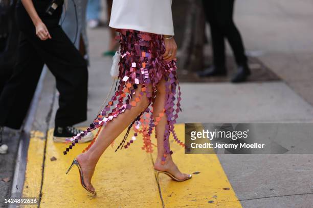 Guest is seen wearing white blazer jacket, a pink sequins long skirt and silver metallic heels, outside Jonathan Simkhai, during New York Fashion...