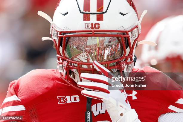 Picture of the reflection on the shield of Braelon Allen of the Wisconsin Badgers before the game against the New Mexico State Aggies at Camp Randall...