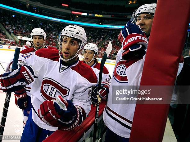 Aaron Palushaj of the Montreal Canadiens taunts Justin Faulk of the Carolina Hurricanes to continue their fight during play at PNC Arena on April 5,...