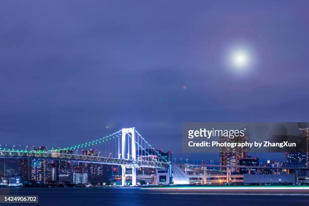 wide view of tokyo city at night, toyosu aera. - toyosu stock-fotos und bilder