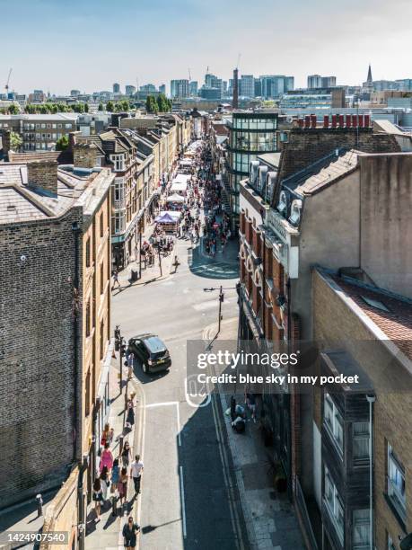 london - brick lane, the famous street in the east of london from a drone perspective - east london fotografías e imágenes de stock