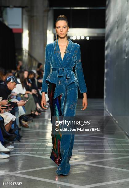 Model walks the runway at the Halpern show during London Fashion Week September 2022 on September 18, 2022 in London, England.