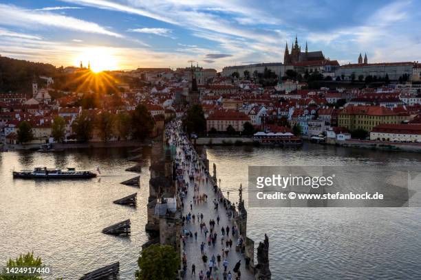 sunset over the charles bridge in prague - prague castle stock pictures, royalty-free photos & images