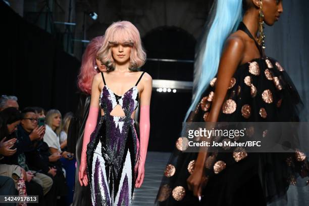 Model walks the runway at the Halpern show during London Fashion Week September 2022 on September 18, 2022 in London, England.