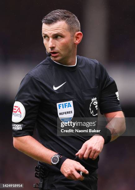 Referee, Michael Oliver looks on during the Premier League match between Everton FC and West Ham United at Goodison Park on September 18, 2022 in...