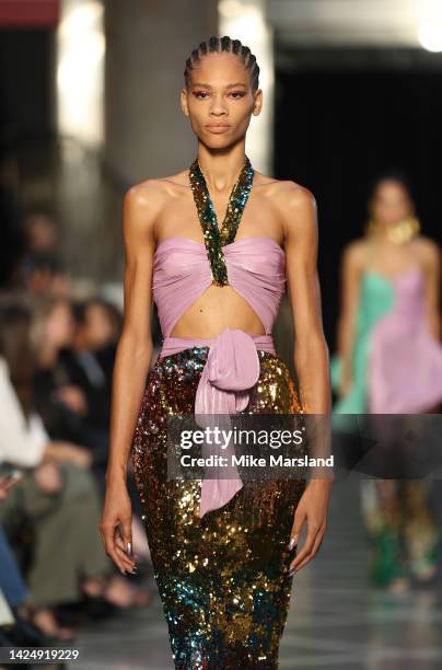 Model walks the runway at the Halpern show during London Fashion Week September 2022 on September 18, 2022 in London, England.