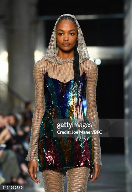 Model walks the runway at the Halpern show during London Fashion Week September 2022 on September 18, 2022 in London, England.