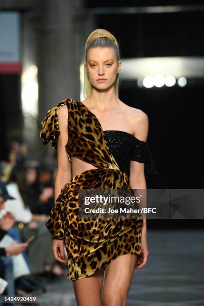 Model walks the runway at the Halpern show during London Fashion Week September 2022 on September 18, 2022 in London, England.