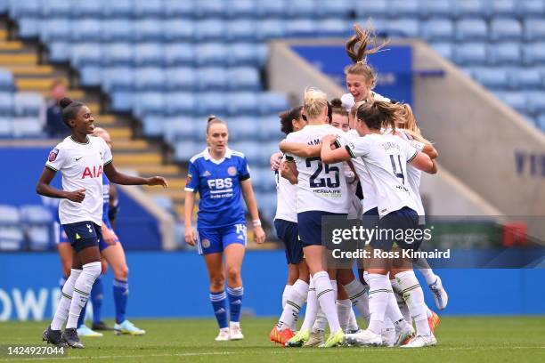 Ashleigh Neville of Tottenham Hotspur celebrates with teammates after scoring their team's first goal during the FA Women's Super League match...