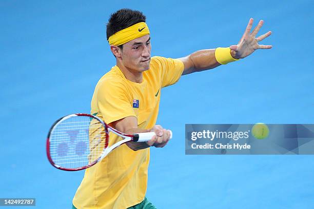 Bernard Tomic of Australia plays a forehand in his singles match against Min-Hyeok Cho of Korea on day one of the Davis Cup Asia Oceania Zone Second...