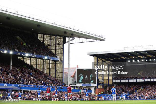 General view as an LED board inside the stadium displays a tribute to Her Majesty Queen Elizabeth II, who passed away at Balmoral Castle on September...