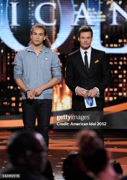 Eliminated contestant DeAndre Brackensick and host Ryan Seacrest performs onstage at FOX's "American Idol" Season 11 Top 8 To 7 Live Elimination Show...