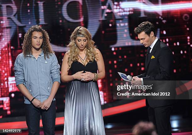 Contestants DeAndre Brackensick and Elise Testone and host Ryan Seacrest onstage at FOX's "American Idol" Season 11 Top 8 To 7 Live Elimination Show...