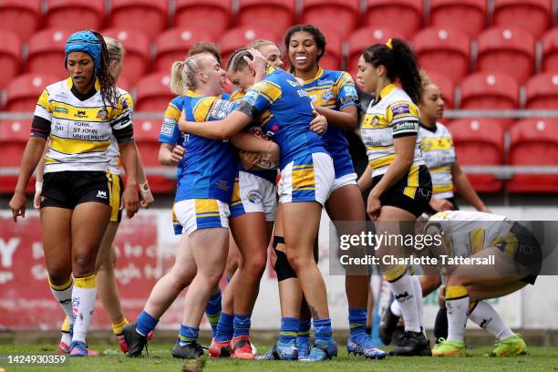 Caitlin Beevers of Leeds Rhinos celebrates with team mates after scoring their sides first try during the Betfred Women's Super League Grand Final...