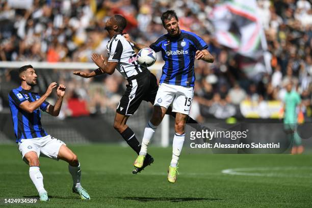 Beto of Udinese Calcio competes for the ball with Francesco Acerbi of FC Internazionale during the Serie A match between Udinese Calcio and FC...