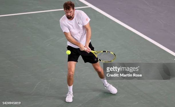 Oscar Otte of Germany plays a backhand against Thanasi Kokkinakis of Australia during the Davis Cup Group Stage 2022 Hamburg match between Germany...