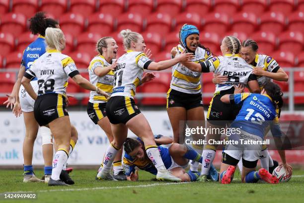 Sinead Peach of York City Knights celebrates with team mates after scoring their sides first try during the Betfred Women's Super League Grand Final...