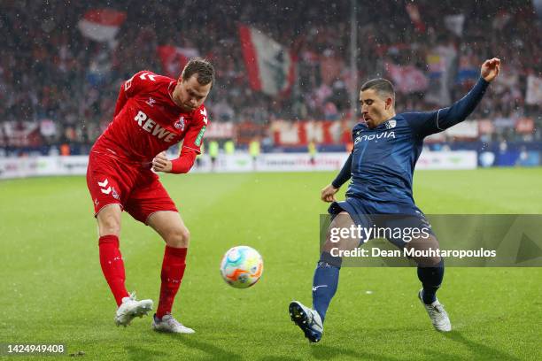 Benno Schmitz of 1. FC Koeln crosses the ball whilst under pressure from Danilo Soares of VfL Bochum during the Bundesliga match between VfL Bochum...