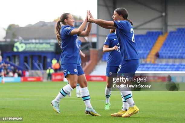 Fran Kirby of Chelsea celebrates with teammate Sam Kerr after scoring their side's first goal from the penalty spot during the FA Women's Super...