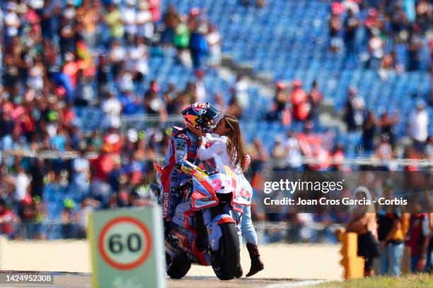 Enea Bastianini of Italy and Gresini Racing MotoGP with his partner celebrating his vicotry after the MotoGP race at Motorland Aragon Circuit on...