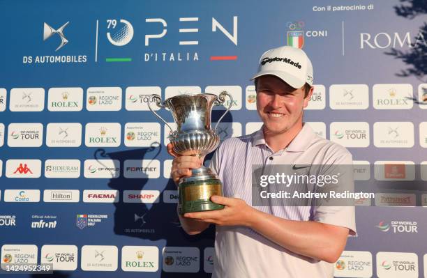Robert MacIntyre of Scotland with the trophy after winning The Italian Open on Day Four of the DS Automobiles Italian Open 2022 at Marco Simone Golf...