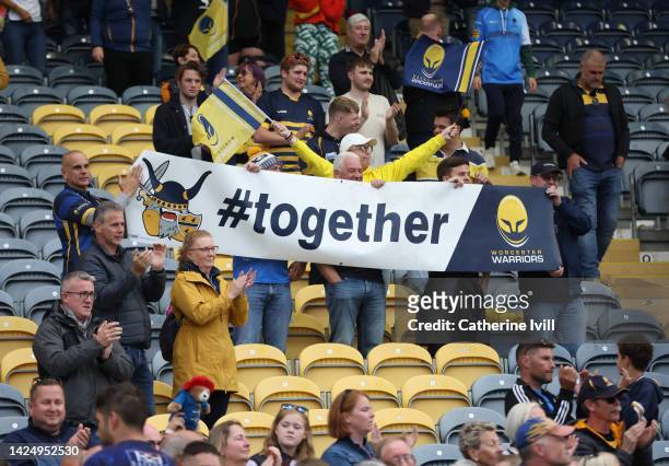 Fans of Worcester Warriors hold up a banner saying Together in support of the club during the Gallagher Premiership Rugby match between Worcester...