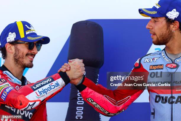 Francesco 'Pecco' Bagnaia and Enea Bastianini of Italy on the podium during the MotoGP race at Motorland Aragon Circuit on September 18, 2022 in...