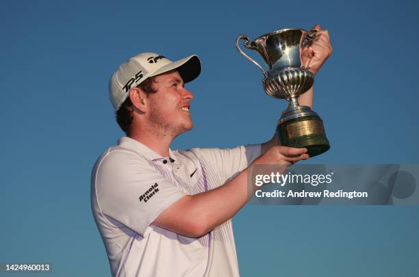 Robert MacIntyre of Scotland celebrates with the trophy after winning The Italian Open on Day Four of the DS Automobiles Italian Open 2022 at Marco...