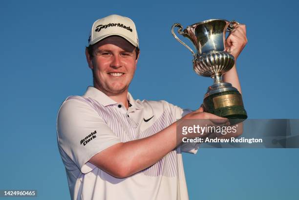 Robert MacIntyre of Scotland celebrates with the trophy after winning The Italian Open on Day Four of the DS Automobiles Italian Open 2022 at Marco...
