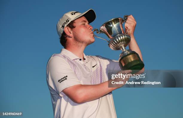 Robert MacIntyre of Scotland celebrates with the trophy after winning The Italian Open on Day Four of the DS Automobiles Italian Open 2022 at Marco...