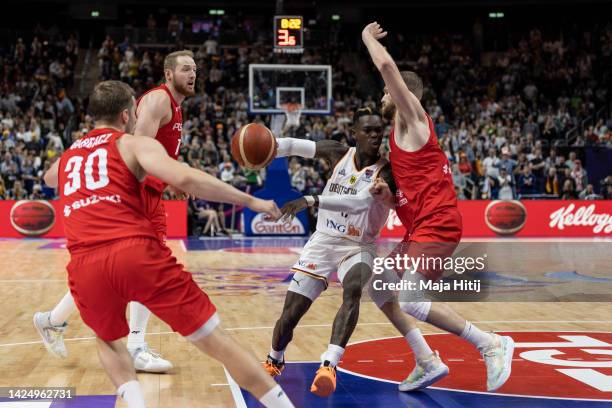 Dennis Schroder of Germany is blocked by Michal Sokolowski of Polandduring the FIBA EuroBasket 2022 3rd place match between Germany v Poland at...