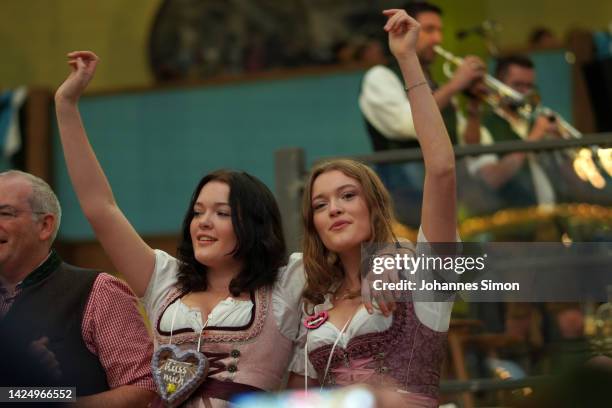 Revelers enjoy to stay in the Ochsenbraterei Spaten tent on day two of the 2022 Oktoberfest beer fest on September 18, 2022 in Munich, Germany. This...