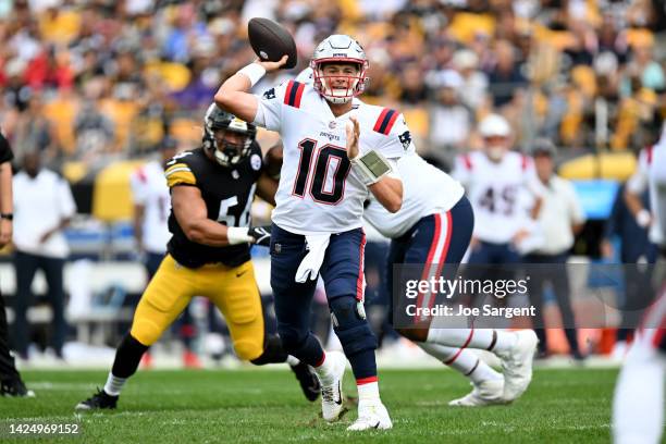 Mac Jones of the New England Patriots throws a pass in the first quarter during a game against the Pittsburgh Steelers at Acrisure Stadium on...