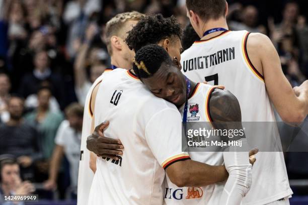 Dennis Schroder of Germany celebrates with Maodo Lo after winning bronze medal after the FIBA EuroBasket 2022 3rd place match between Germany v...
