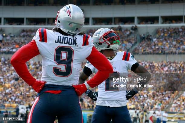 Matthew Judon and Jalen Mills of the New England Patriots celebrate an interception in the first quarter against the Pittsburgh Steelers at Acrisure...