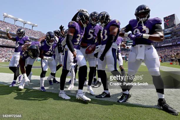 Marcus Williams of the Baltimore Ravens celebrates with teammates after an interception in the first quarter against the Miami Dolphins at M&T Bank...