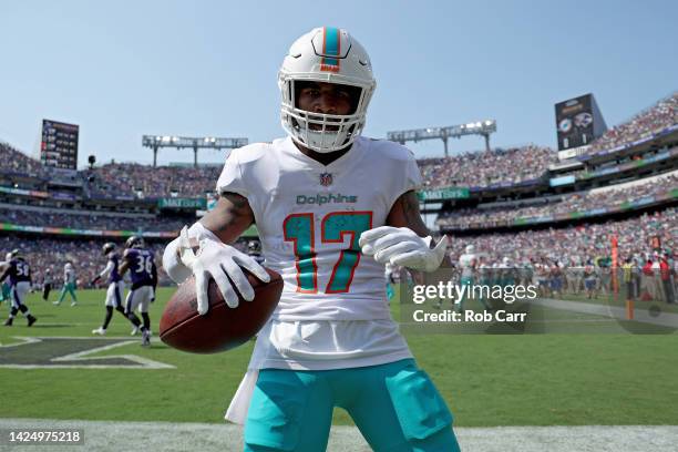 Jaylen Waddle of the Miami Dolphins celebrates a touchdown in the first half against the Baltimore Ravens at M&T Bank Stadium on September 18, 2022...