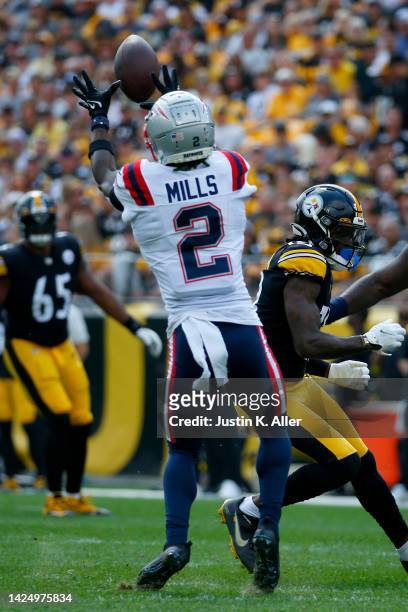 Jalen Mills of the New England Patriots intercepts a pass during the first quarter in the game against the Pittsburgh Steelers at Acrisure Stadium on...