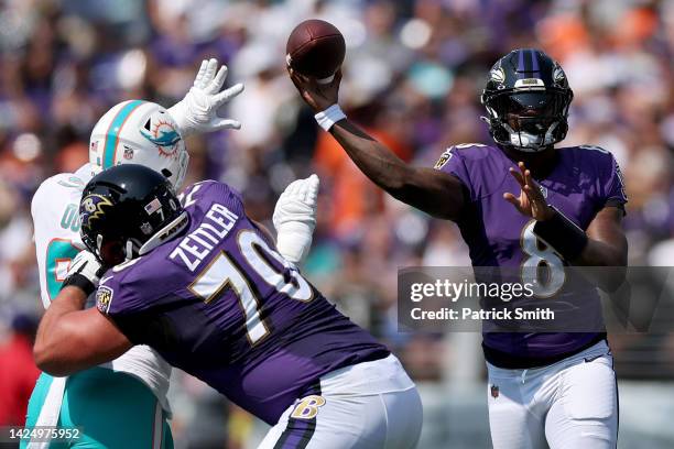 Lamar Jackson of the Baltimore Ravens throws a pass in the first half against the Miami Dolphins at M&T Bank Stadium on September 18, 2022 in...