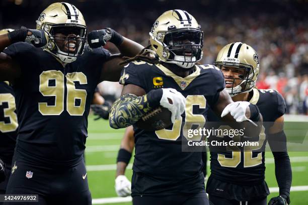 Demario Davis of the New Orleans Saints celebrates with his teammates after he recovers a fumble by Tom Brady of the Tampa Bay Buccaneers in the...