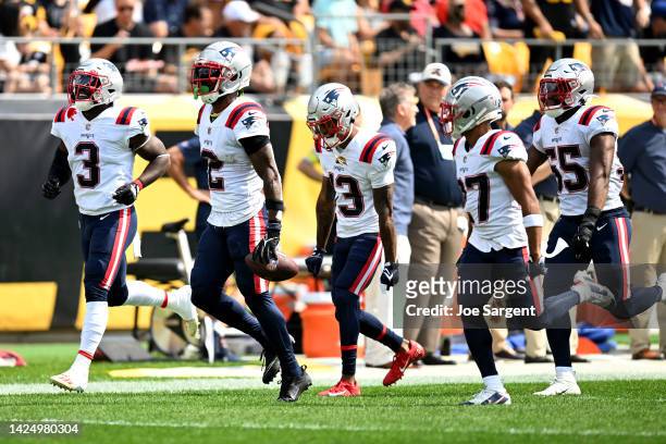 Jalen Mills of the New England Patriots celebrates an interception with his team during the first half in the game against the Pittsburgh Steelers at...
