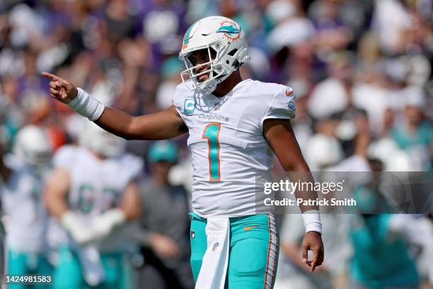 Tua Tagovailoa of the Miami Dolphins celebrates a touchdown in the second quarter against the Baltimore Ravens at M&T Bank Stadium on September 18,...