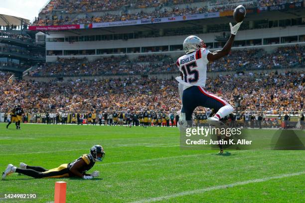 Nelson Agholor of the New England Patriots scores a touchdown during the first half in the game against the Pittsburgh Steelers at Acrisure Stadium...