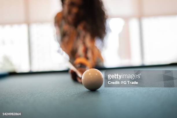 woman playing snooker at the office - pool ball stock pictures, royalty-free photos & images