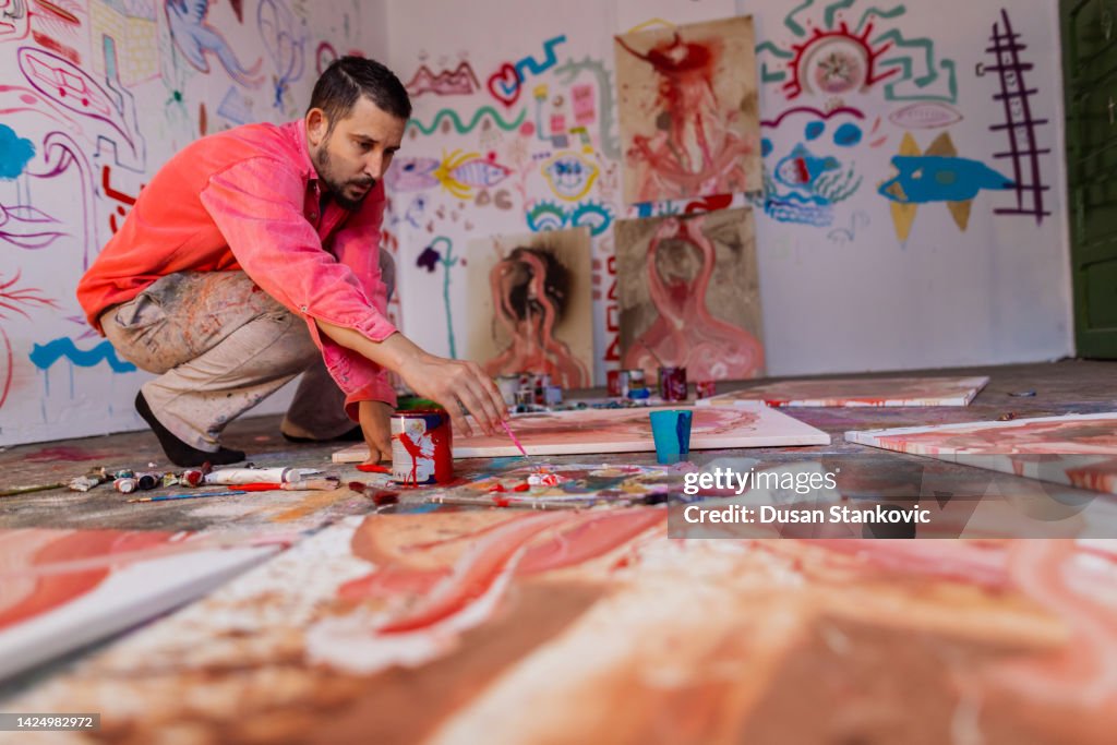 Artist working on painting