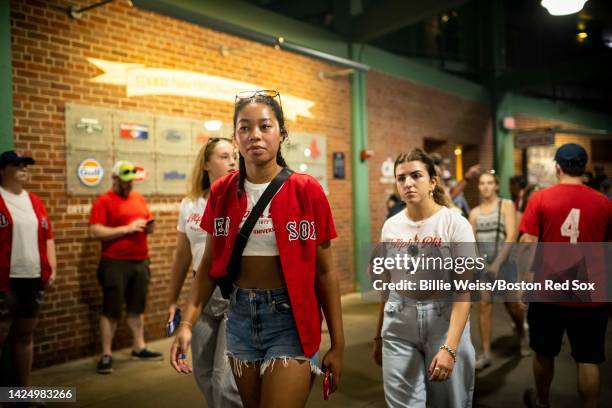 Fans walk through the concourse during a game between the Boston Red Sox and the Kansas City Royals on September 18, 2022 at Fenway Park in Boston,...