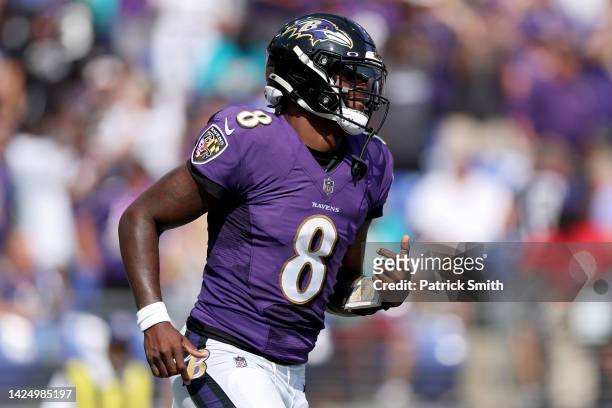 Lamar Jackson of the Baltimore Ravens celebrates a touchdown pass in the second quarter against the Miami Dolphins at M&T Bank Stadium on September...