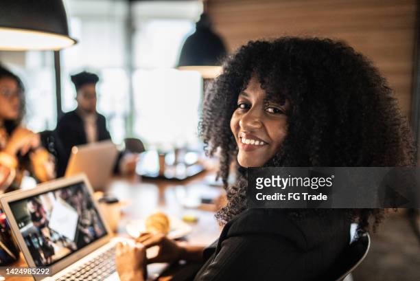 portrait of a businesswoman in a metting at the office - founder stock pictures, royalty-free photos & images