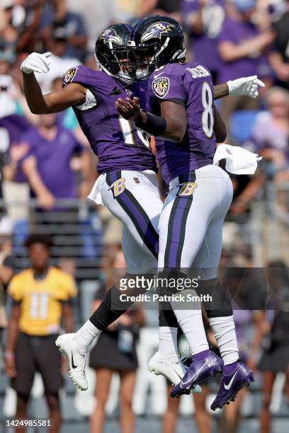 Demarcus Robinson and Lamar Jackson of the Baltimore Ravens celebrate a touchdown in the second quarter against the Miami Dolphins at M&T Bank...