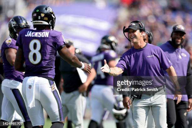 Baltimore Ravens head coach John Harbaugh celebrates a touchdown with Lamar Jackson in the second quarter against the Miami Dolphins at M&T Bank...